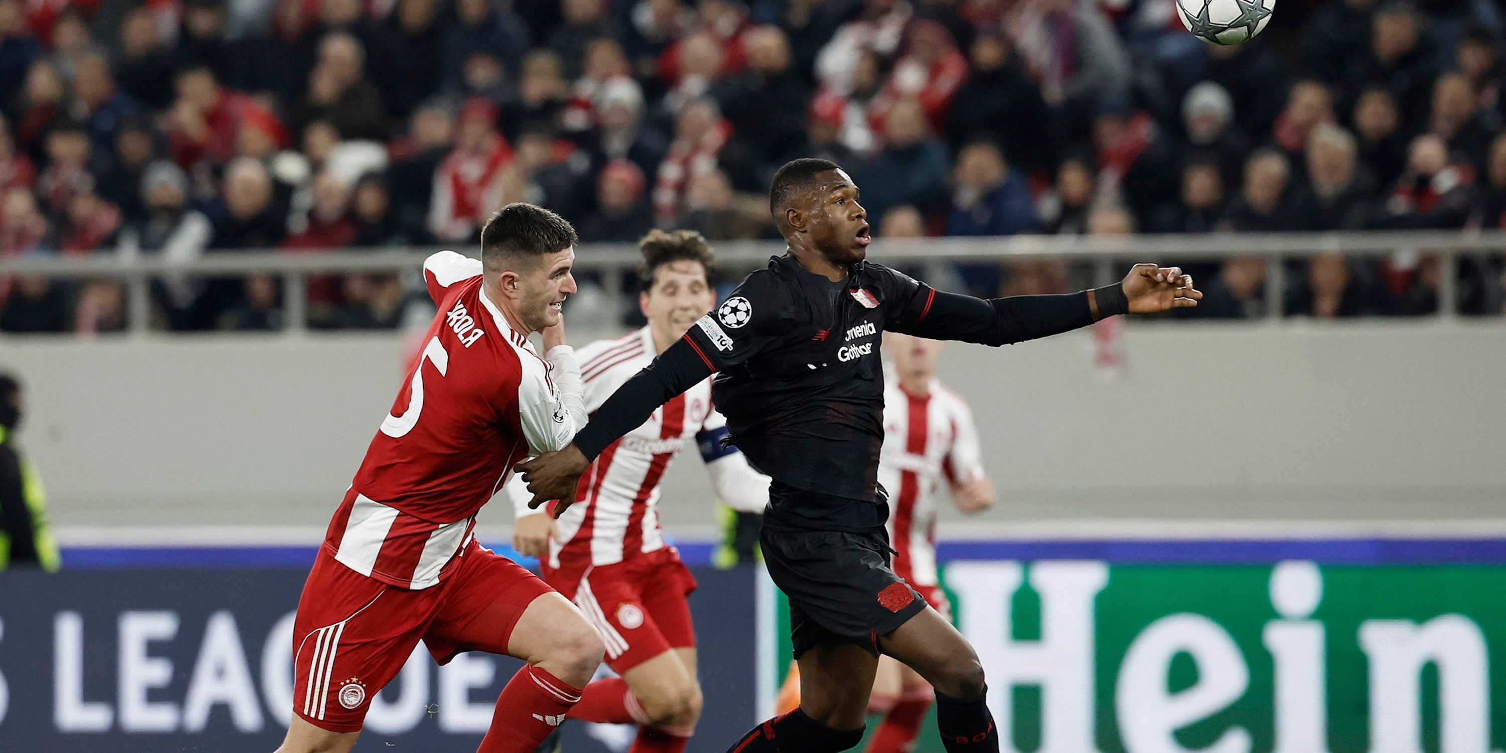  Bayer Leverkusen's Christian Kofane in action with Olympiacos' Lorenzo Pirola