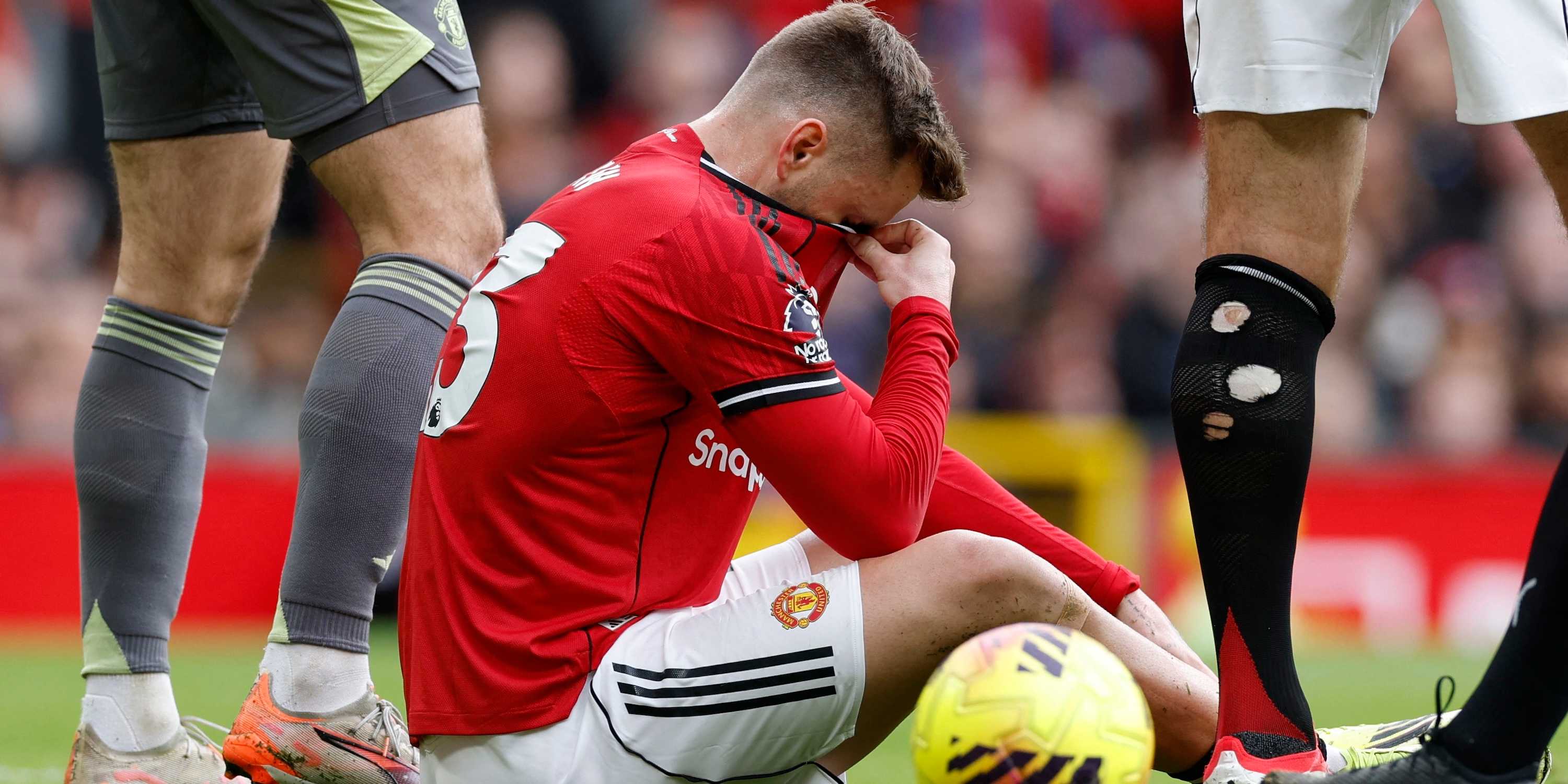Manchester United's Luke Shaw reacts after sustaining an injury 